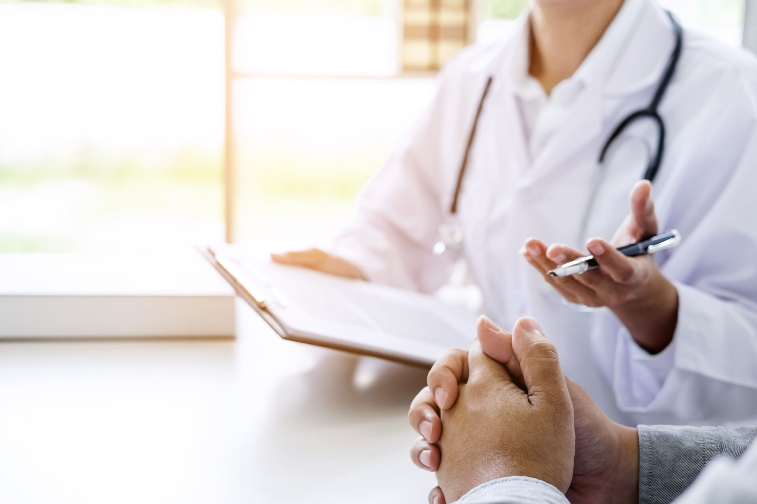 doctor-filling-up-an-history-form-while-consulting-2026-01-11-08-38-57-utc
