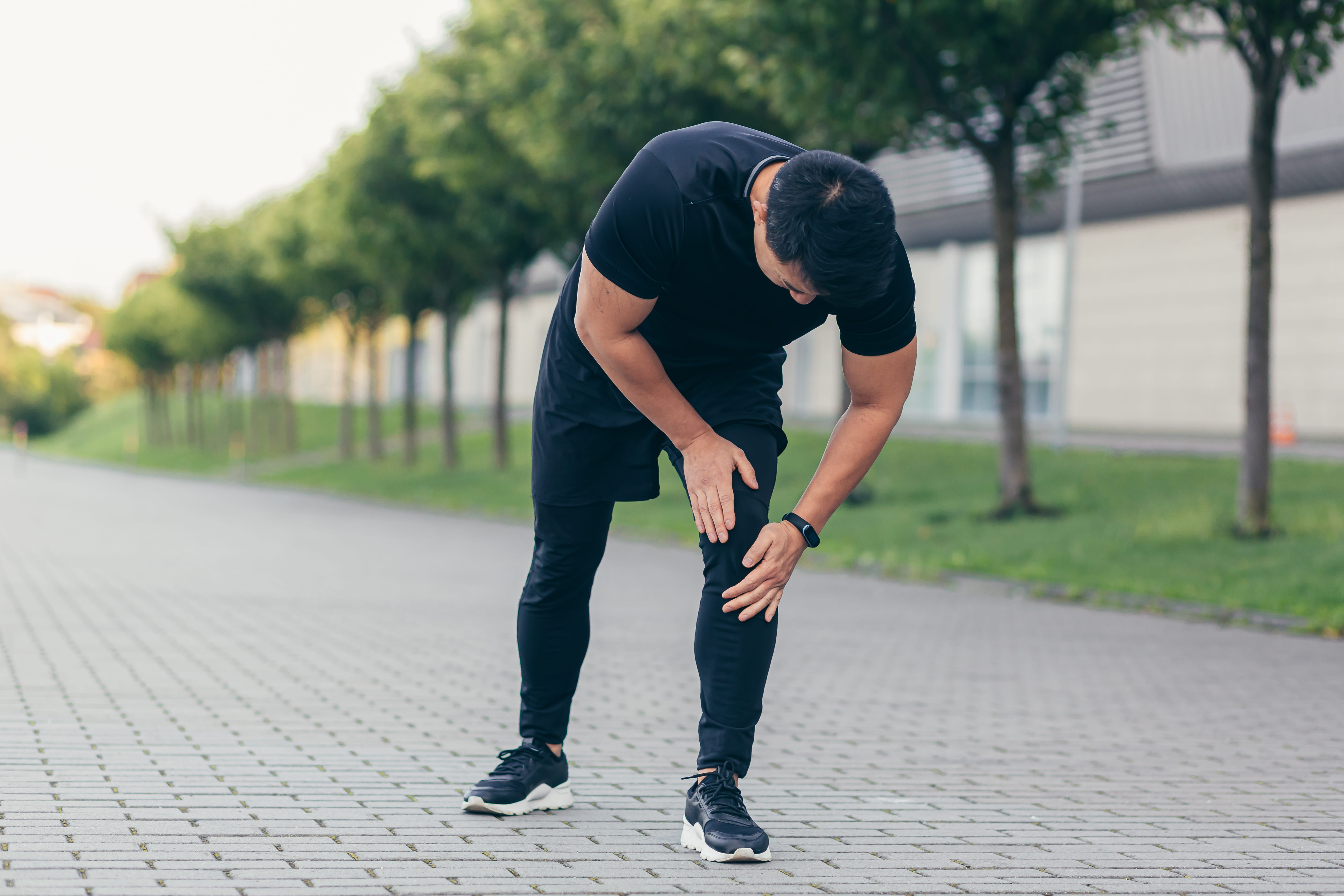 man-with-dark-hair-holding-knee-in-pain-2026-03-24-23-12-03-utc (1)