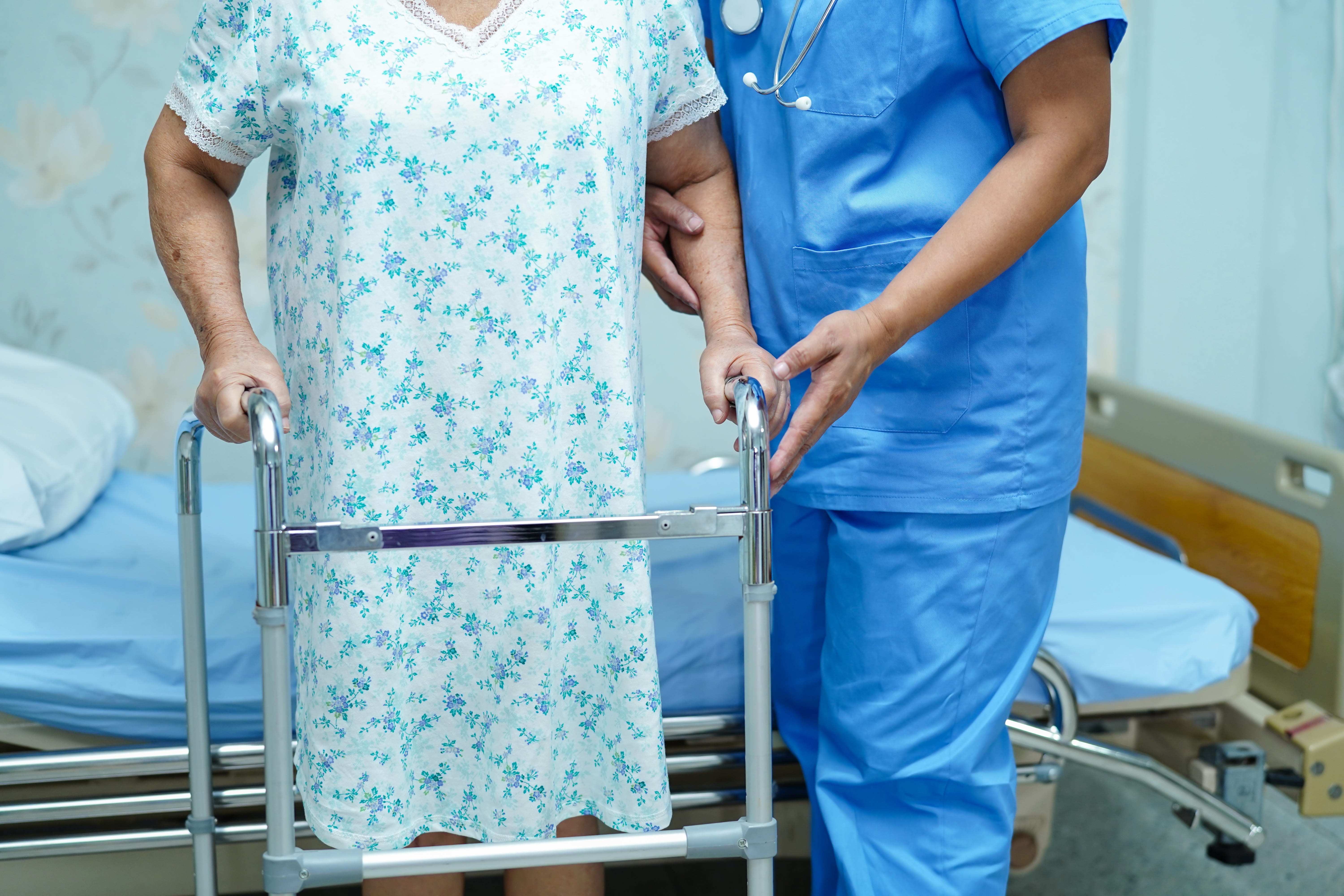 senior-woman-with-walker-assisted-by-healthcare-wo-2026-09-21-19-57-43-utc (1)