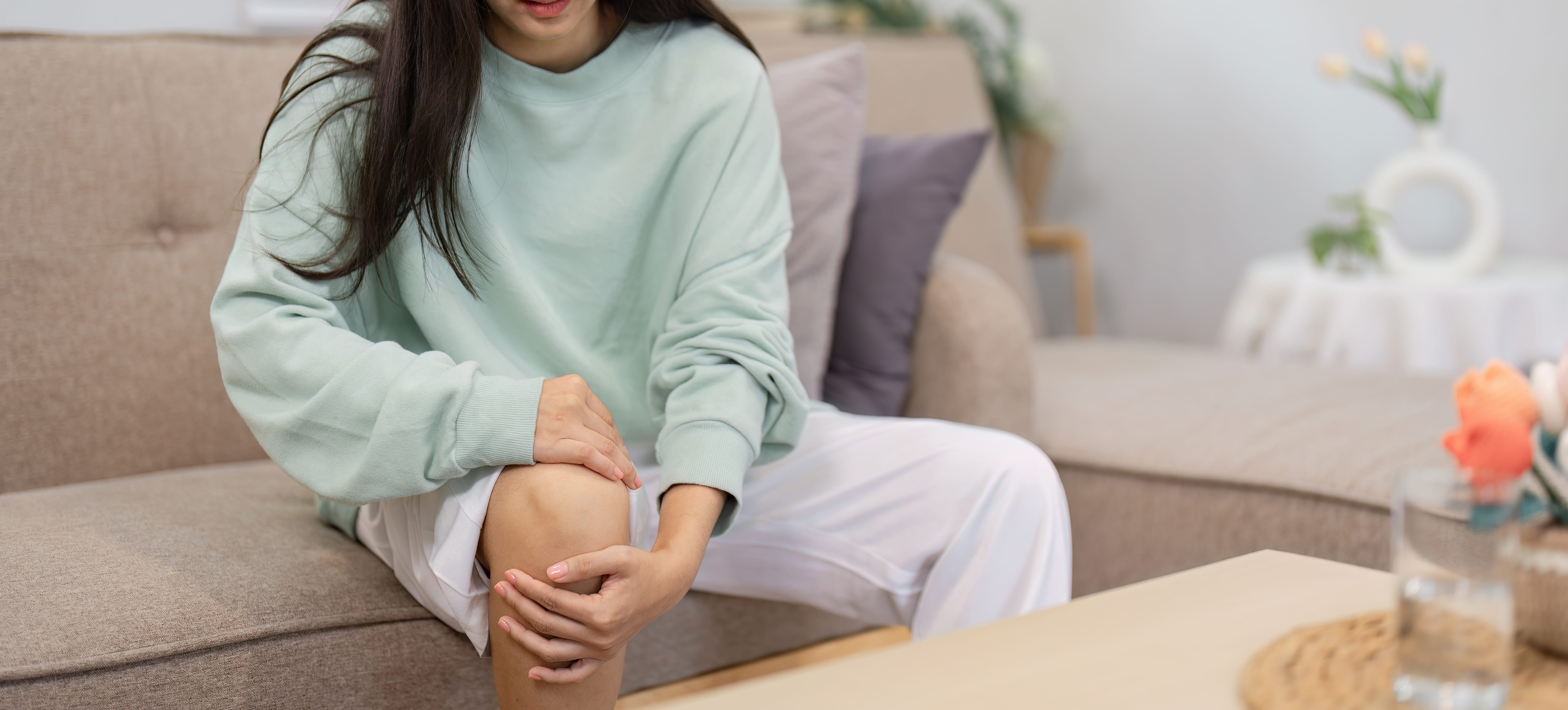 young-woman-with-knee-pain-sitting-indoors-2026-09-23-18-52-47-utc (1)